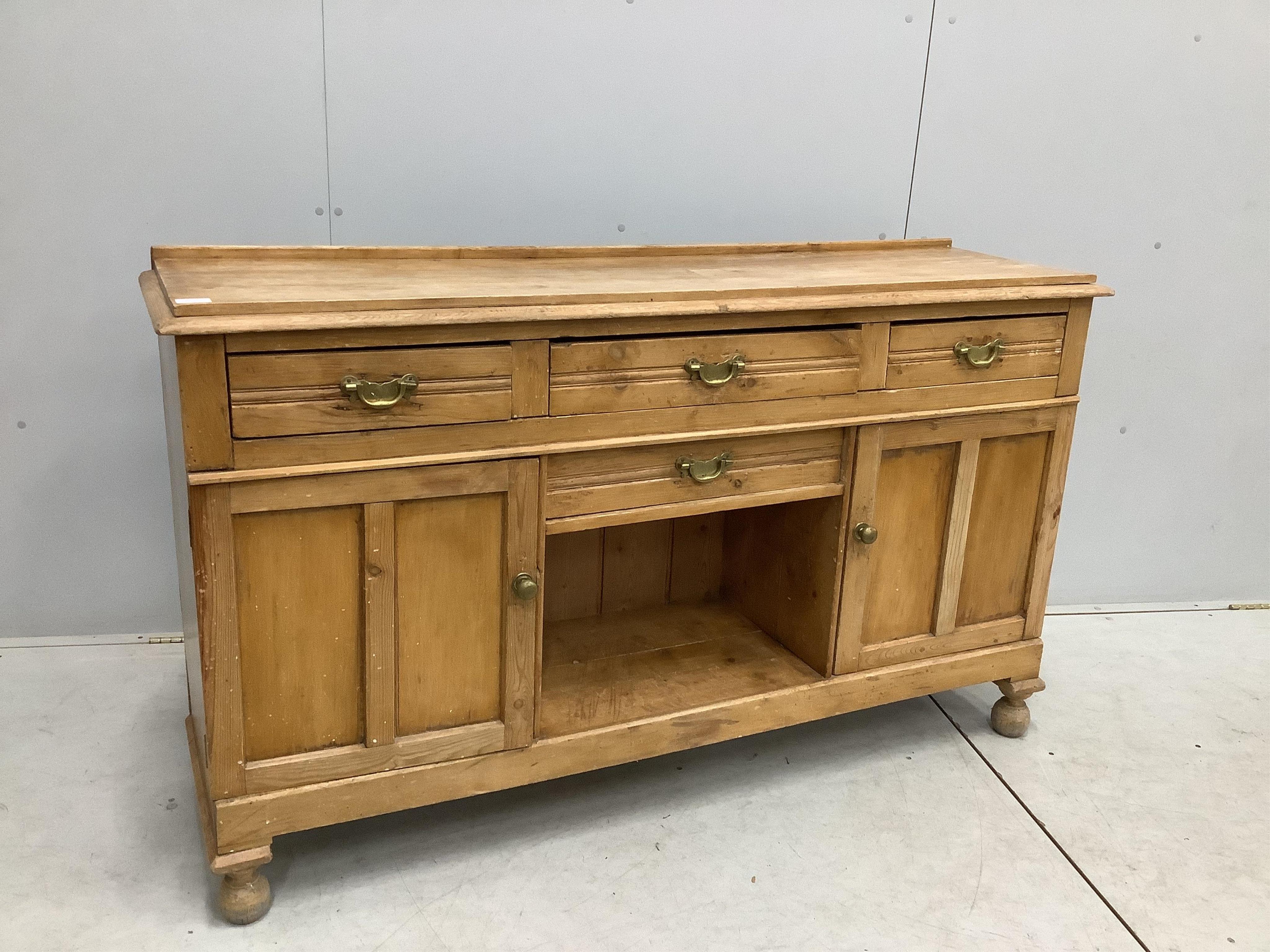 A late Victorian pine low dresser, width 154cm, depth 42cm, height 90cm. Condition - fair